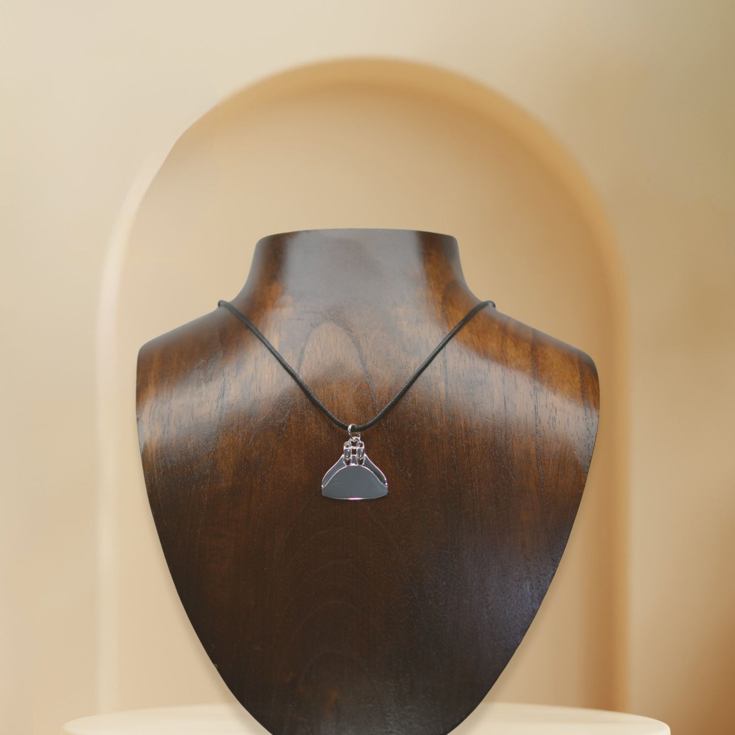 Freediving monofin or monoplame necklace. Made from highly polished, tarnish resistant silver, strung on a strong cord. © Adrian Ashley