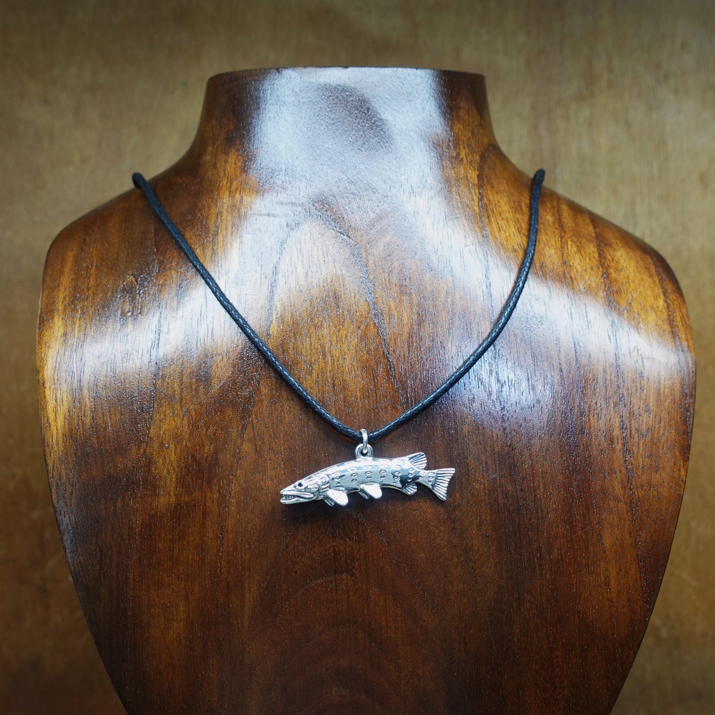 Pike fishing necklace. Made from sterling silver with an antiqued finish, set with a gemstone eye.. Ideal fisherman’s angling gift © Adrian Ashley