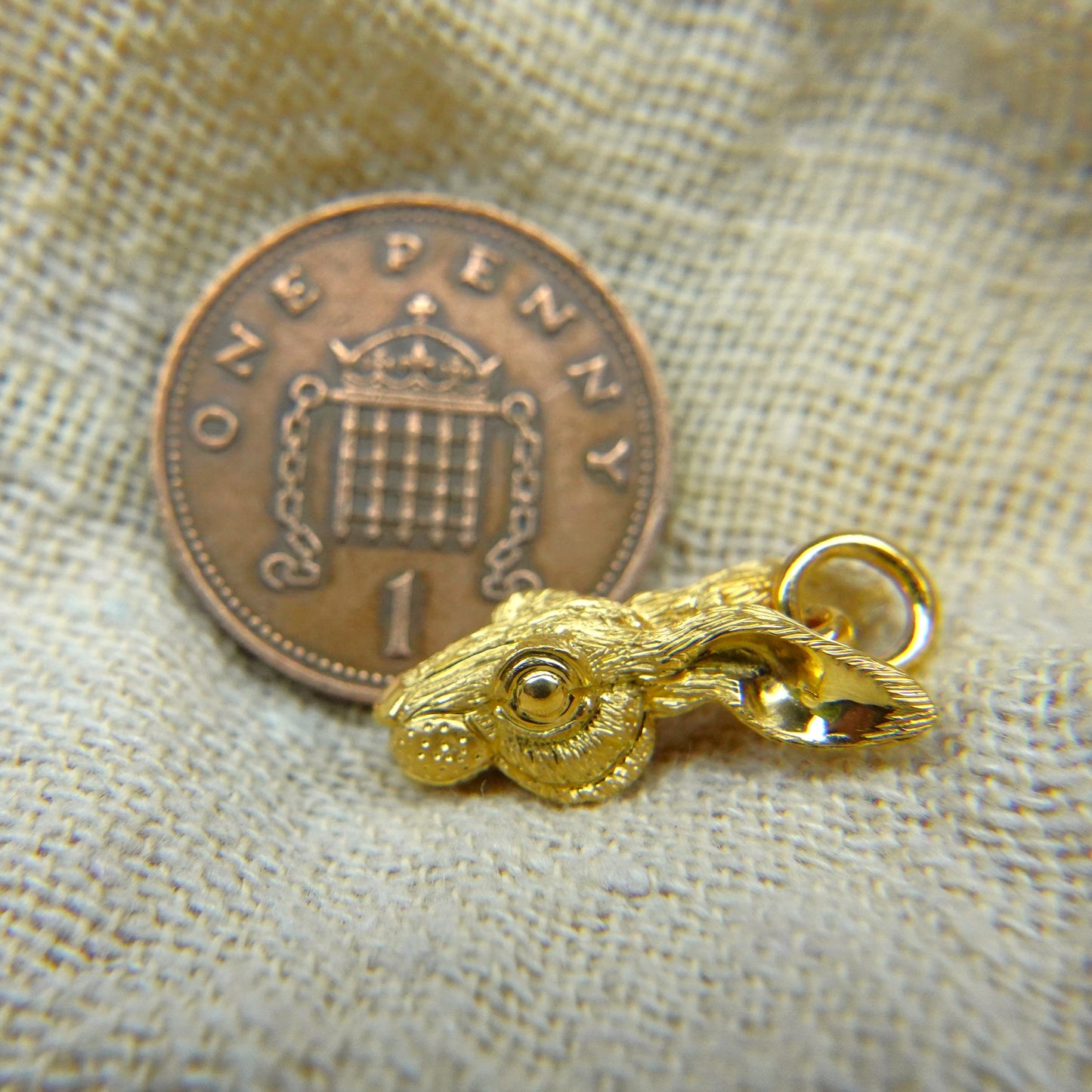 Solid 22ct gold hare pendant and platinum chain. Handmade to order. © Adrian Ashley