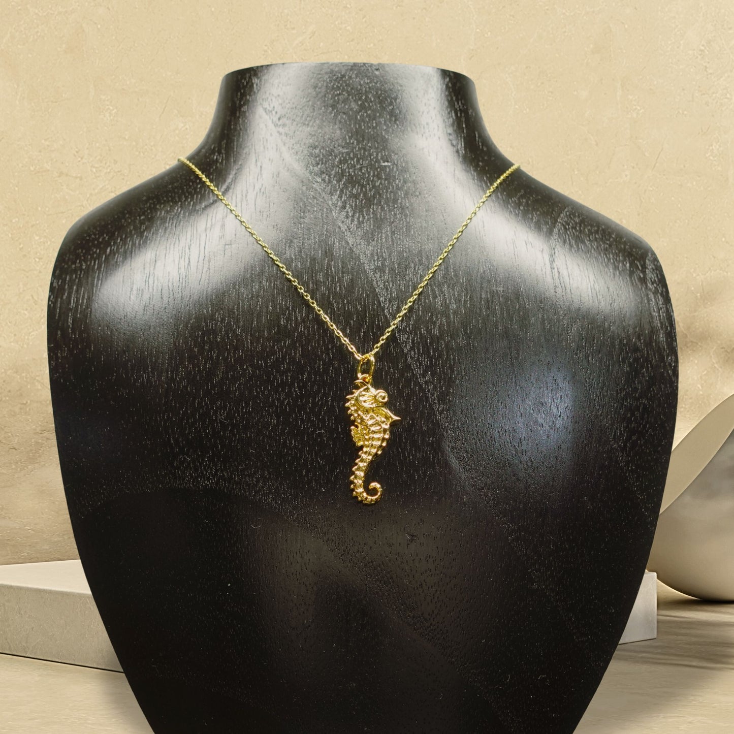 Gold plated silver Seahorse pendant and chain. © Adrian Ashley