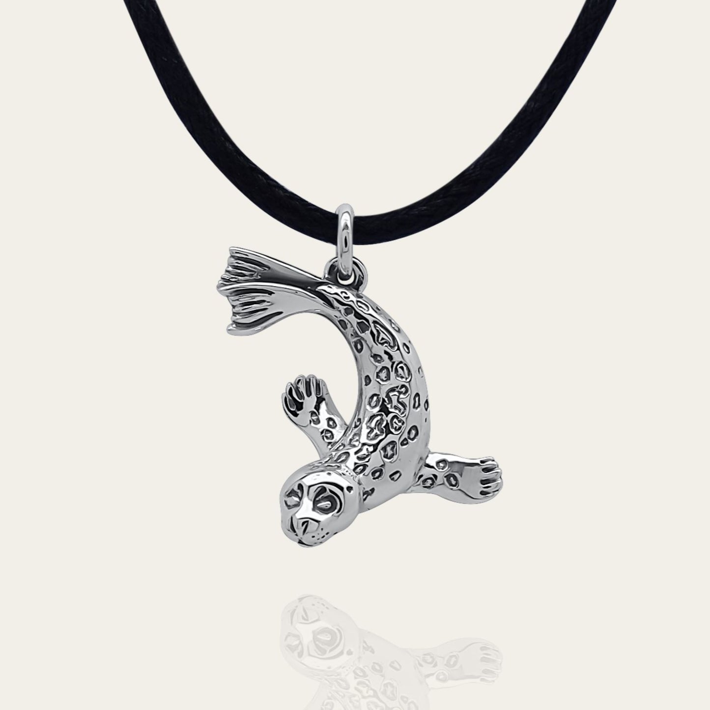 Seal necklace. Made from sterling silver with an antiqued finish. © Adrian Ashley