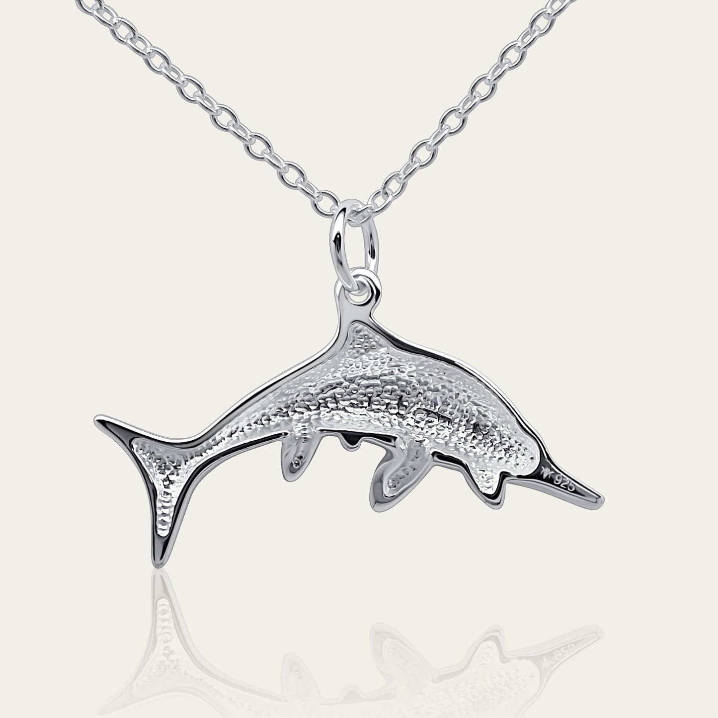 Ichthyosaurus necklace, Made from highly polished, tarnish resistant silver, hung on a solid silver chain. © Adrian Ashley