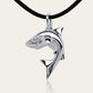 Baby shark charm 3D necklace made from highly polished, tarnish resistant silver, strung on a strong cord. © Adrian Ashley