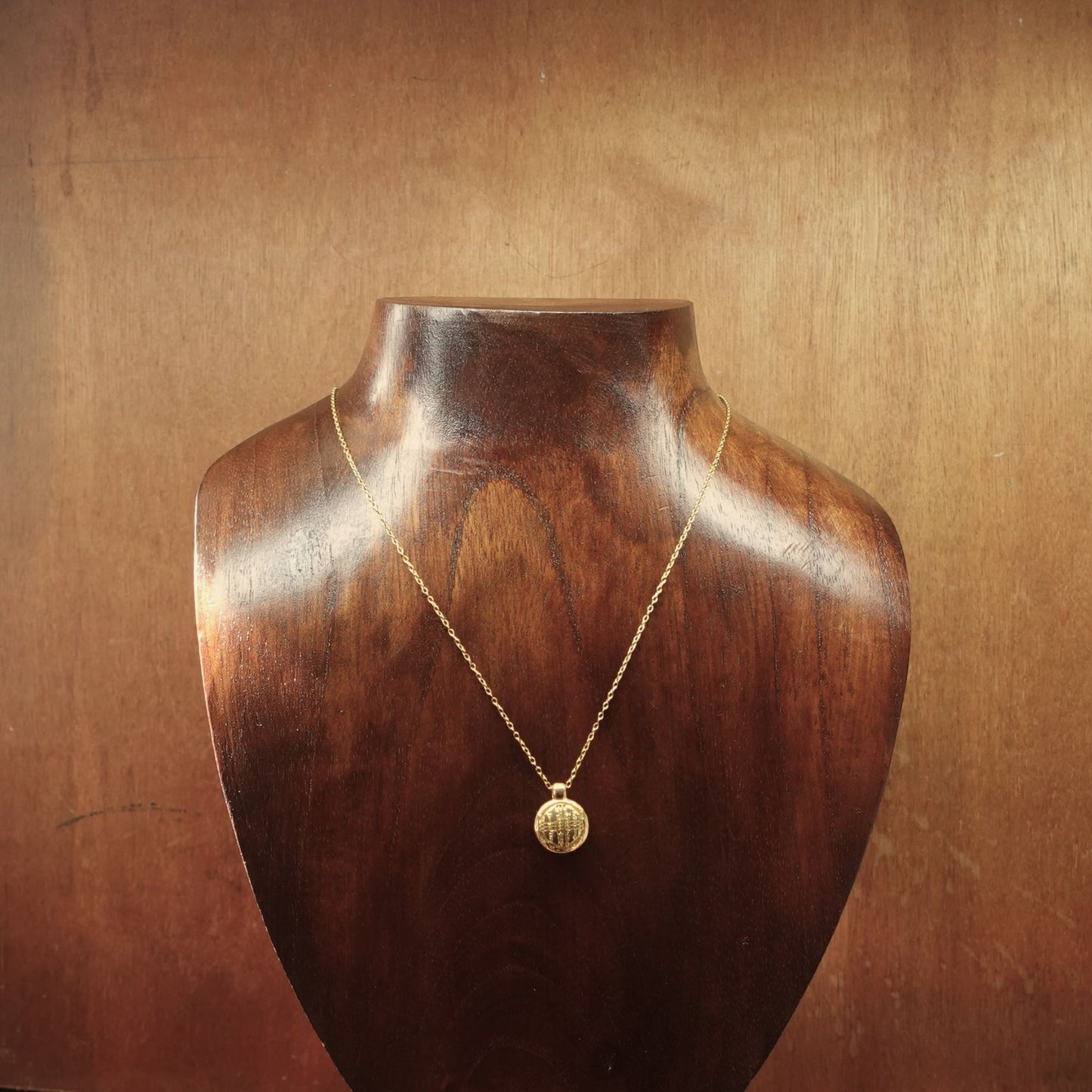 Gold vermeil Tengri charm pendant and chain. © Adrian Ashley