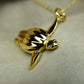 Gold plated silver Sea Turtle pendant and chain. © Adrian Ashley