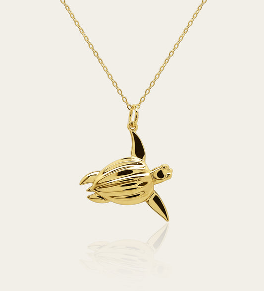 Gold plated silver Sea Turtle pendant and chain. © Adrian Ashley