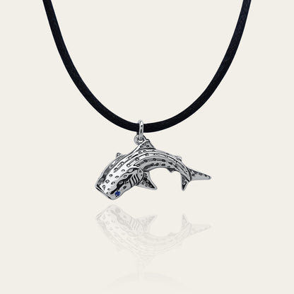 Whale shark necklace. Made from sterling silver with an antiqued finish, set with a gemstone eye. Diver's pendant © Adrian Ashley