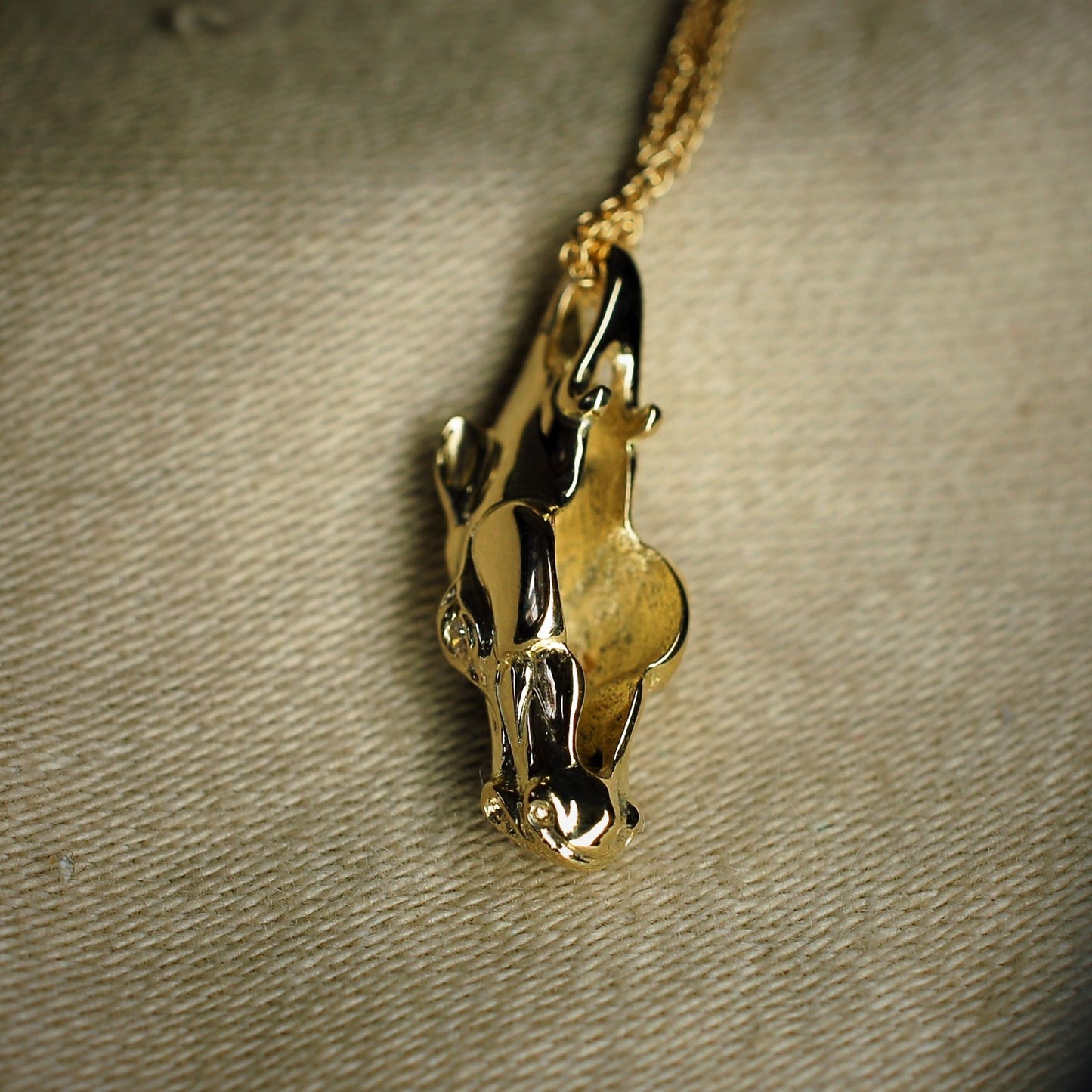 Gold horse necklace, horse head pendant. Diamond eyed equestrian jewellery on a gold chain. Made to order. © Adrian Ashley