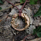 Mid-sized ouroboros dragon pendant. Gold dragon necklace with a ruby eye. Hand made to order. © Adrian Ashley