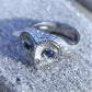 Silver and sapphire owl ring, platinum plated sterling silver barn owl with sapphire eyes. © Adrian Ashley