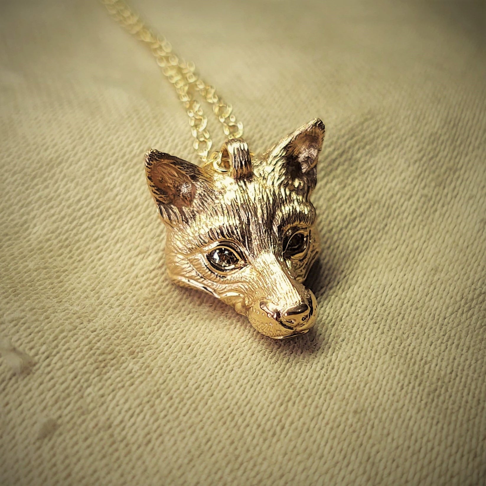 Gold fox Necklace. Fox head pendant with natural diamond eyes and a so adrian ashley