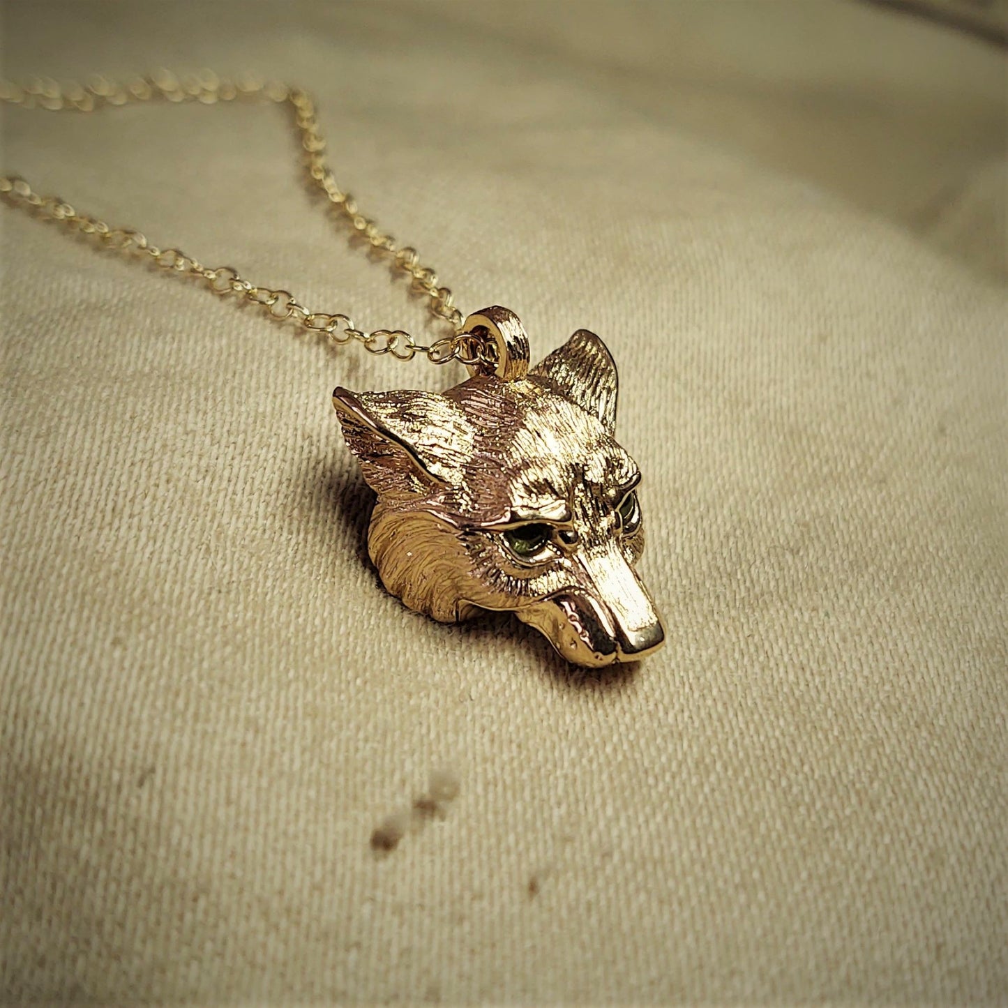 Gold wolf Necklace, Wolf's head pendant with natural peridot gemstone eyes, solid gold chain. Hand made to order. © Adrian Ashley