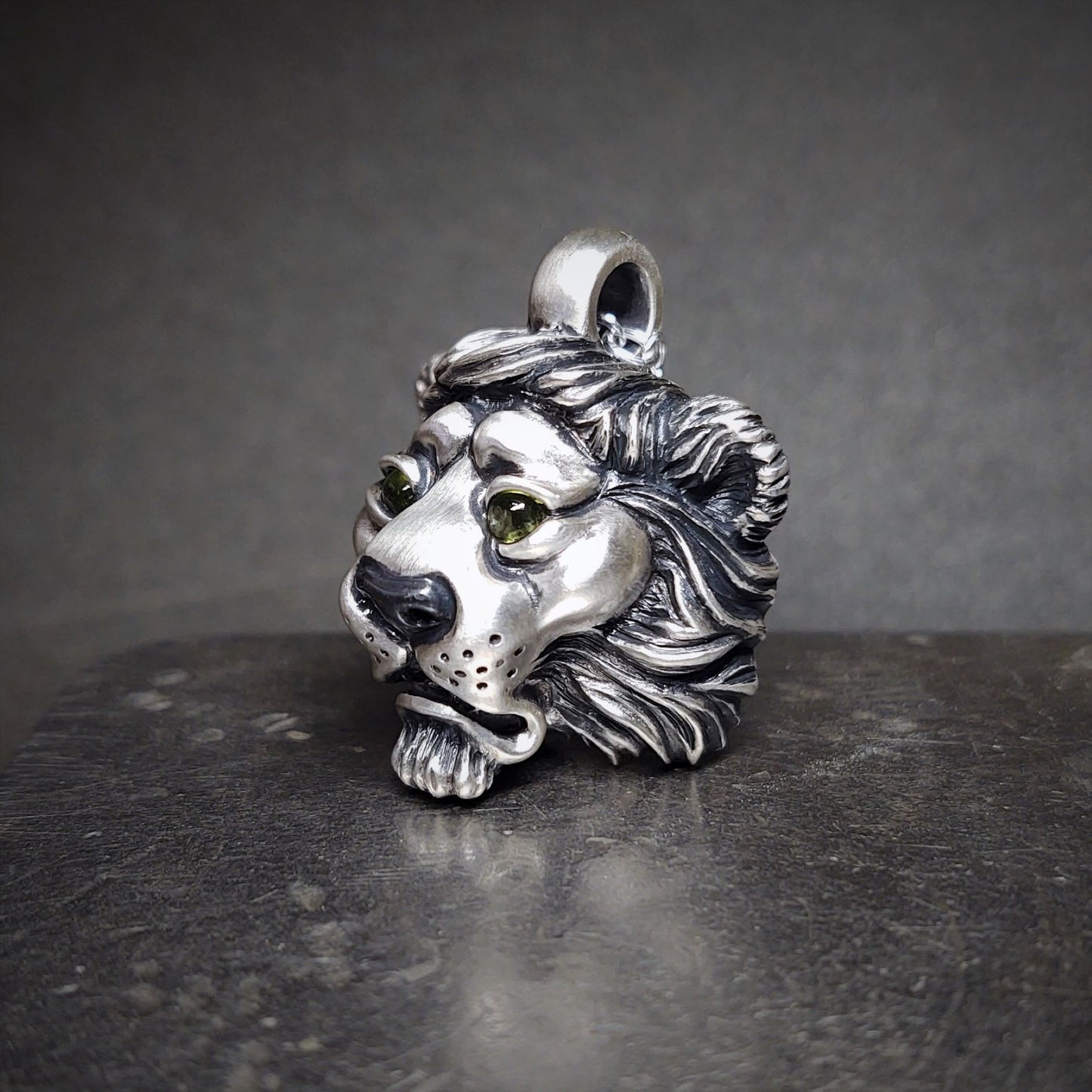 Regal Lion necklace. Mid-size lion's head pendant in sterling silver with natural gemstone eyes and solid silver chain. Made to order © Adrian Ashley