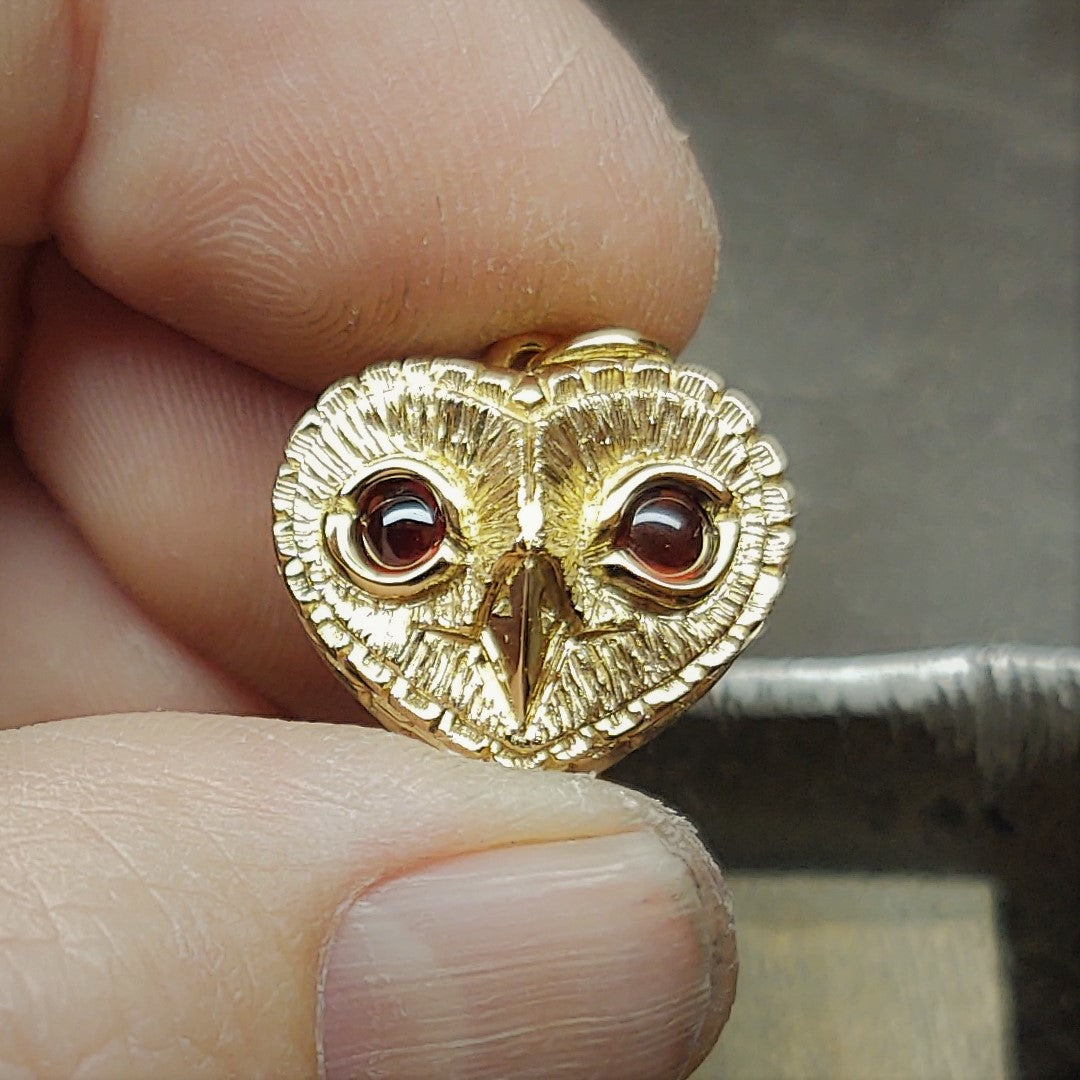 Gold owl necklace Solid gold and garnet, heart shaped owl pendant. Hand made to order. © Adrian Ashley