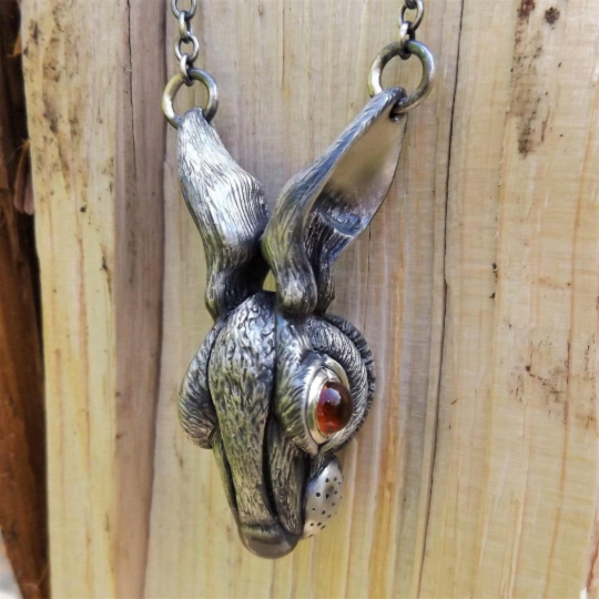 Rabbit necklace. Sterling silver hare pendant with natural gemstone eyes. Hand made to order. © Adrian Ashley