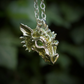 Green dragon necklace. Sterling silver dragon pendant, with natural peridot eyes and a solid silver chain. Made to order. © Adrian Ashley