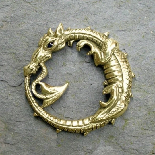 Large ouroboros dragon pendant. Gold dragon necklace with a sapphire eye. Hand made to order. © Adrian Ashley