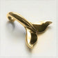 Whale tail necklace. Classic gold whale fluke necklace. Hand made to order. © Adrian Ashley