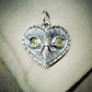 Diamond owl necklace. Sterling silver heart shaped owl head pendant with natural, rose cut, diamond eyes © Adrian Ashley