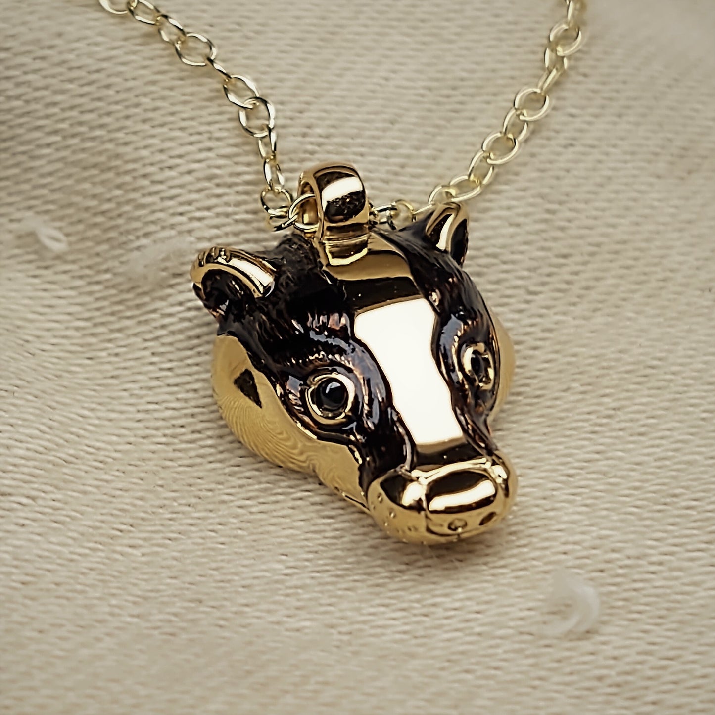 Gold badger Necklace, gold and natural sapphire badger head pendant with a solid gold chain. This piece will be hand made for you in the UK. © Adrian Ashley
