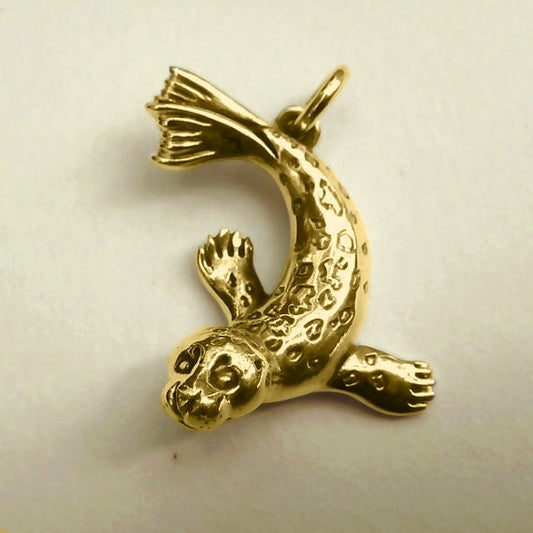 Seal necklace. Gold seal charm pendant. Animal totem jewellery. Handmade to order. © Adrian Ashley