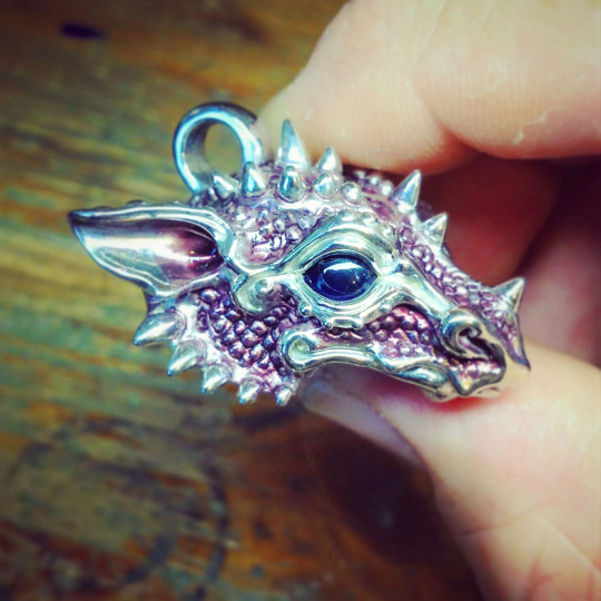 Purple dragon necklace. Sterling silver dragon pendant, with natural iolite eyes and a solid silver chain. Made to order. © Adrian Ashley