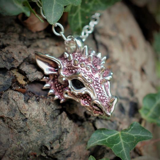 Purple dragon necklace. Sterling silver dragon pendant, with natural iolite eyes and a solid silver chain. Made to order. © Adrian Ashley