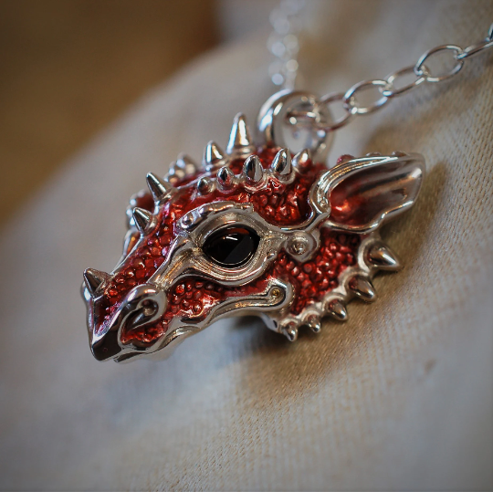 Red dragon necklace. Sterling silver dragon pendant, with natural garnet eyes and a solid silver chain. Made to order. © Adrian Ashley